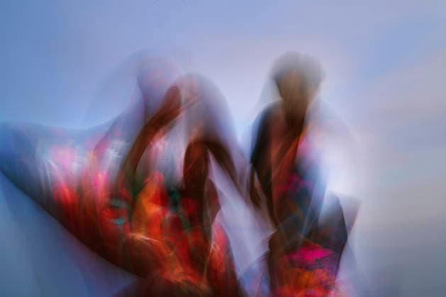Abstract blurred man and woman dance against the colorful sky model released, Symbolfoto property released, AZF01438