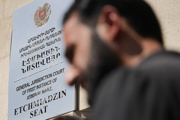ARMENIA, YEREVAN - AUGUST 7, 2026: A man is seen outside a court building ahead of a hearing against Catholicos Garegin II of All Armenians over allegations of failing to comply with a civil court order. Alexander Patrin TASS  95875119