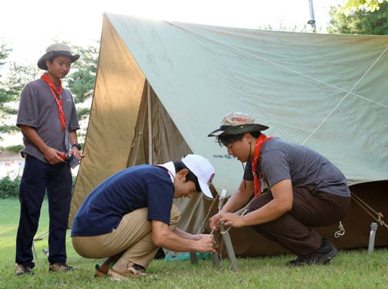 Prince Hisahito joins boy scout event in western Japan Japanese Prince Hisahito (C) sets up a tent during the 19th Nippon Scout Jamboree in Jinsekikogen in Hiroshima Prefecture, western Japan, on Aug. 7, 2026. (Pool photo)  A14AA0005625344P