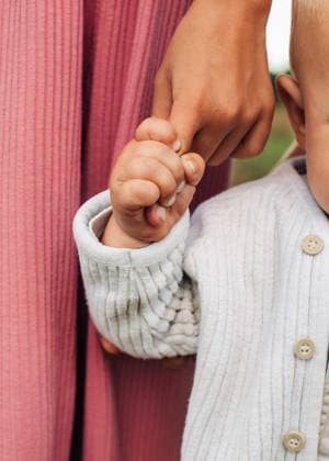 Child holds mother finger outdoors showing trust model released, Symbolfoto, NASF00289