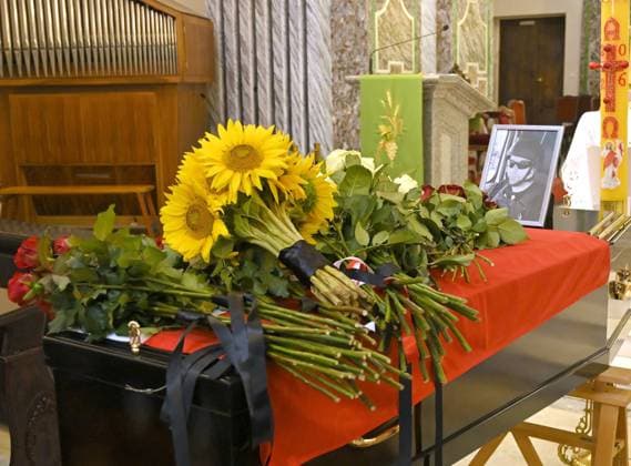 Flowers lay on the coffin of Polish volunteer Marek Rusek-Wolski, who was killed near Kharkiv by a Russian drone attack, during the farewell ceremony at the Cathedral of St Alexander in Kyiv, Ukraine, August 7, 2026. The tragedy occurred at the end of July (approximately 27 July) near Kharkiv, when the volunteer came under a targeted Russian drone strike while on a humanitarian mission. Marek Rusek-Wolski was an administrator of the Polish volunteer community Razem dla Ukrainy. Since early 2023, he had been regularly travelling to Ukraine. He used to organise fundraisers, purchase and deliver food, medicines, hygiene products and animal feed to the most dangerous front-line settlements in the Kharkiv region. (Photo by Yevhen Kotenko Ukrinfo  Copyright: xYevhenxKotenkox
