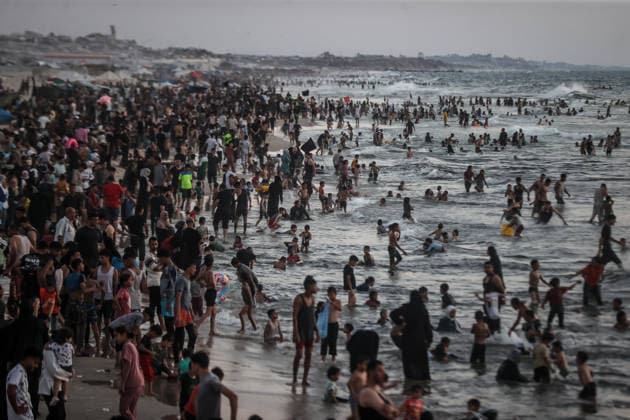 Daily life in Gaza GAZA CITY, GAZA, PALESTINE - AUGUST 7: Palestinians gather along the beach in Gaza City to cool off and seek relief from soaring summer temperatures and severe living conditions stemming from ongoing Israeli attacks on Gaza, Palestine on August 7, 2026. Palestinian families spend time swimming in the sea and strolling along the shore to find a brief respite from the crisis Ali Jadallah Anadolu Gaza City Gaza. Editorial use only. Please get in touch for any other usage.  Copyright: x2026xAnadoluxAlixJadallahx