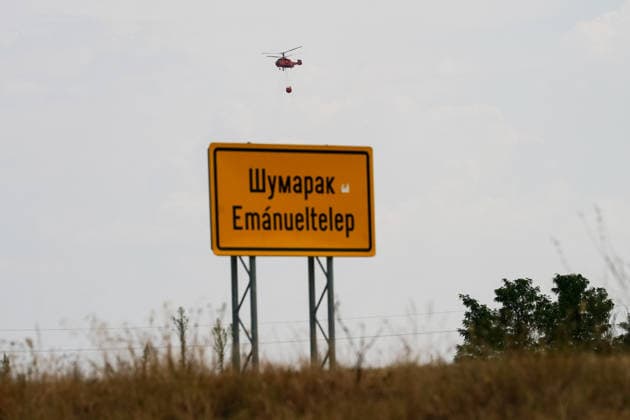 August 7, 2026, Sumarak, Vojvodina, Serbia: 202687, Sumarak, Serbia - Thick smoke rises above the landscape as a massive wildfire burns through the Deliblato Sands (Deliblatska Pescara) Special Nature Reserve. Helicopters of the Serbian Armed Forces are deployed to combat the blaze, using Bambi buckets to fetch water and extinguish the fire from the air. Deliblato Sands, often referred to as the European Sahara, is a strictly protected natural area. Sumarak Serbia  - ZUMAd223 20260807_zip_d223_001 Copyright: xMarkoxDimicx