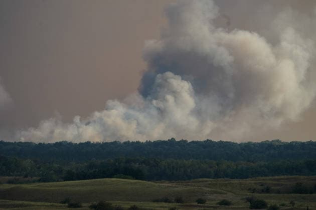 August 7, 2026, Sumarak, Vojvodina, Serbia: 202687, Sumarak, Serbia - Thick smoke rises above the landscape as a massive wildfire burns through the Deliblato Sands (Deliblatska Pescara) Special Nature Reserve. Helicopters of the Serbian Armed Forces are deployed to combat the blaze, using Bambi buckets to fetch water and extinguish the fire from the air. Deliblato Sands, often referred to as the European Sahara, is a strictly protected natural area. Sumarak Serbia - ZUMAd223 20260807_zip_d223_012 Copyright: xMarkoxDimicx