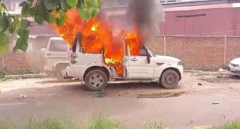 PATNA, INDIA - AUGUST 7: Police vehicles set ablaze by an angry mob after a speeding bus struck and fatally ran over a 22-year-old local resident Manish Kumar along National Highway 30 near the Zero Mile intersection under the Agamkuan police station limits on August 7, 2026 in Patna, India. Incensed by the fatal hit-and-run incident, angry residents and eyewitnesses staged a road blockade, vandalized passing vehicles including public transport bus, three police vehicles, and several two-wheelers. The mob also pelted stones at responding law enforcement teams.(Photo by Santosh Kumar Hindustan Times) Angry Mob Torches Bus, Police Vehicles After Youth Killed by Speeding Bus In Patna