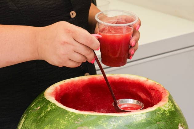 ARMENIA, YEREVAN - AUGUST 8, 2026: A woman serves watermelon juice during the Siroooon Arm Fest festival celebrating the culture of Armenia in Seasons Park, central Yerevan. Alexander Patrin TASS  95906003