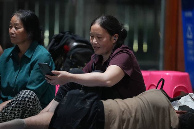 (260808) -- TAIZHOU, Aug. 8, 2026 -- Residents are pictured at a temporary shelter in a middle school in Yuhuan, Taizhou City, east China s Zhejiang Province, Aug. 8, 2026. Coastal areas of eastern China were bracing for strong winds and torrential rain as Typhoon Dolphin approached, prompting authorities to recall fishing boats, suspend ferry services and prepare for evacuations. China s meteorological authority on Saturday upgraded its emergency response for Dolphin to Level III and raised the typhoon warning from yellow to orange. ) CHINA-ZHEJIANG-TYPHOON DOLPHIN-PREVENTION (CN) HuangxZongzhi 