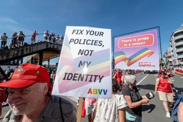 A person carries a pamflet during the 2026 edition of the Antwerp Pride Parade, part of the Antwerp Pride 2022 festivities that celebrate and support the lesbian, gay, bisexual and transgender oriented people and their allies, Friday 07 August 2026 in Antwerpen.  JONASxROOSENS 182956214