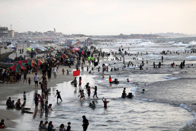 Palestinian families seek respite from summer heat on Gaza beach Palestinian families gather on the beach in Gaza City to escape the summer heat and spend time by the sea, as tents sheltering displaced Palestinians line the coast, on August 8, 2026. Residents seek moments of rest amid difficult living conditions caused by the war. Photo by Bilal Osama apaimages Gaza city Gaza Strip Palestinian Territory 080826_Gaza_BO_02(67) Copyright: xapaimagesxBilalxOsamax xapaimagesx