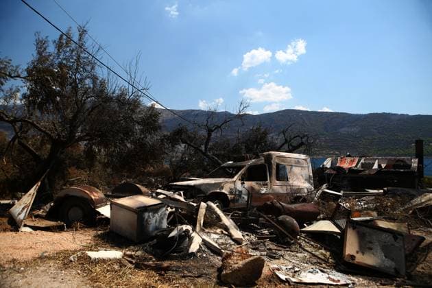 August 8, 2026, Porto Germeno, Greece: PORTO GERMENO, Greece Ã¢â‚¬ August 8, 2026: Five days after a wildfire swept through Porto Germeno, burned forests, damaged homes, and destroyed property remain across the affected area. With most residents evacuated, workers and emergency personnel continue clearing damaged areas, restoring infrastructure, and monitoring the fire-scarred landscape. Photos by JNA Press. Porto Germeno Greece - ZUMAq101 20260808_zna_q101_175 Copyright: xHarrisxXanthopoulosx