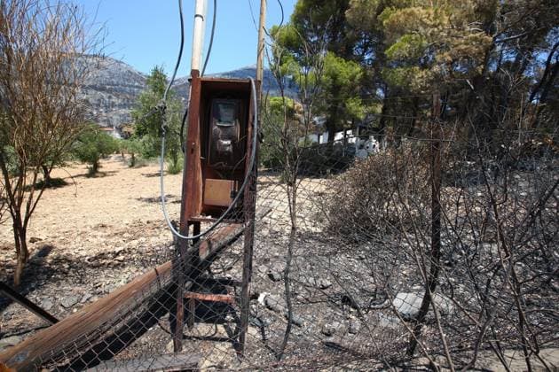 August 8, 2026, Porto Germeno, Greece: PORTO GERMENO, Greece Ã¢â‚¬ August 8, 2026: Five days after a wildfire swept through Porto Germeno, burned forests, damaged homes, and destroyed property remain across the affected area. With most residents evacuated, workers and emergency personnel continue clearing damaged areas, restoring infrastructure, and monitoring the fire-scarred landscape. Photos by JNA Press. Porto Germeno Greece - ZUMAq101 20260808_zna_q101_178 Copyright: xHarrisxXanthopoulosx