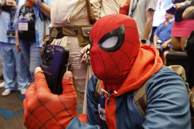 August 8, 2026, St. Petersburg, Florida, USA: A man dressed as Spider Man is seen filming a fetish model dressed as Spider Woman during the Fetish Con trade show on Saturday, Aug. 8, 2026 in St. Petersburg. St. Petersburg USA - ZUMAs70_ 20260808_zan_s70_010 Copyright: xLuisxSantanax