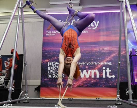 August 8, 2026, St. Petersburg, Florida, USA: Model Zonah dressed as Spider Woman hangs from a BDSM rigging frame during the Fetish Con trade show on Saturday, Aug. 8, 2026 in St. Petersburg. St. Petersburg USA - ZUMAs70_ 20260808_zan_s70_011 Copyright: xLuisxSantanax