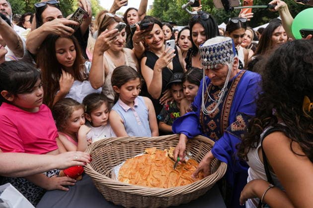 ARMENIA, YEREVAN - AUGUST 8, 2026: People enjoy traditional food during the Siroooon Arm Fest festival celebrating Armenian culture, in Seasons Park. Alexander Patrin TASS  95915042