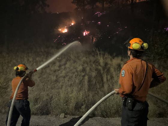 (260809) -- OTTAWA, Aug. 9, 2026 -- This photo provided by the BC Wildfire Service on Aug. 8, 2026 shows firefighters putting out a wildfire near Okanagan Valley in the Southern Interior of British Columbia, Canada. The western Canadian province of British Columbia (B.C.) declared a provincial state of emergency on Saturday as fast-spreading wildfires threatened several communities. (BC Wildfire Service Handout via Xinhua) CANADA-BRITISH COLUMBIA-WILDFIRE LinxWei 