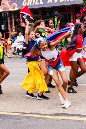 August 8, 2026, Edmonton, Alberta, Canada: A young member of one of the Mas Bands dances through downtown Edmonton during the Cariwest Parade on day 2 of the Cariwest Festival..Western Canada s largest Caribbean Festival, Cariwest, held its annual parade as part of its 42nd year of festivities. The Parade Mas Bands represent the various Caribbean various Islands and are dressed in brightly colored costumes, some of which can weigh up to 200 lbs, requiring wheels to support the weight. Edmonton Canada - ZUMAs197 20260808_aaa_s197_237 Copyright: xRonxPalmerx