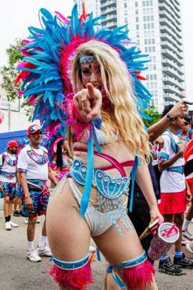 August 8, 2026, Edmonton, Alberta, Canada: Canadian country music artist Jacquie Daniels danced with one of the Mas bands through downtown Edmonton during the Cariwest Parade on day 2 of Cariwest Festival..Western Canada s largest Caribbean Festival, Cariwest, held its annual parade as part of its 42nd year of festivities. The Parade Mas Bands represent the various Caribbean various Islands and are dressed in brightly colored costumes, some of which can weigh up to 200 lbs, requiring wheels to support the weight. Edmonton Canada - ZUMAs197 20260808_aaa_s197_244 Copyright: xRonxPalmerx