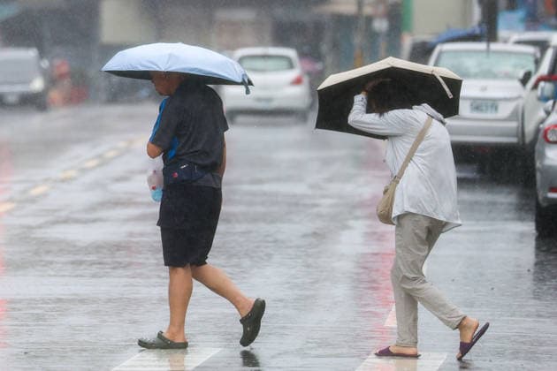 Typhoon Dolphin brings downpours to Taiwan as it moves toward China MIAOLI COUNTY, TAIWAN - AUGUST 9: People hold up umbrellas amid downpours as Typhoon Dolphin brings torrential rains to the island before moving toward China, in Miaoli County, Taiwan, on August 9, 2026. The tropical cyclone brings heavy rains to several parts of Taiwan as it is expected to hit eastern China. Earlier this week, the typhoon slammed Japan, injuring five people and cutting power to 14,000 buildings. Daniel Ceng Anadolu Miaoli county Taiwan. Editorial use only. Please get in touch for any other usage.  Copyright: x2026xAnadoluxDanielxCengx