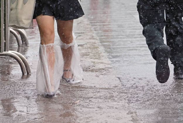 (260809) -- SHANGHAI, Aug. 9, 2026 -- People walk in the rain on a road in Songjiang District of Shanghai, east China, Aug. 9, 2026. Shanghai experienced strong winds and rainfalls on Sunday as Typhoon Dolphin approached, with the typhoon s impact expected to last until Aug. 11. China s national observatory on Sunday activated a red alert -- the highest level in the country s typhoon warning system -- as Typhoon Dolphin approaches. Typhoon Dolphin is forecast to make landfall along the country s east coast from Zhoushan in Zhejiang Province to Fuding in Fujian Province, according to the National Meteorological Center (NMC). ) CHINA-SHANGHAI-TYPHOON DOLPHIN-IMPACT (CN) LiuxYing 