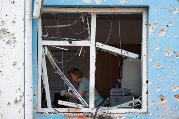 Russia Ukraine Drone Attack 9219357 09.08.2026 A woman is seen through a broken window of a building damaged after a drone attack in the course of Russia s military operation in Ukraine, in Belgorod, Russia. About 30 apartment buildings, three social and six commercial facilities, and dozens of cars were damaged in an overnight attack by the Ukrainian armed forces. Acting Belgorod Region Governor Alexander Shuvayev said that the city had come under a massive Ukrainian attack, which killed three people and injured 13 others, including two children. The death toll later rose to five. Taisia Liskovets Sputnik Belgorod Russia  Copyright: xTaisiaxLiskovetsx