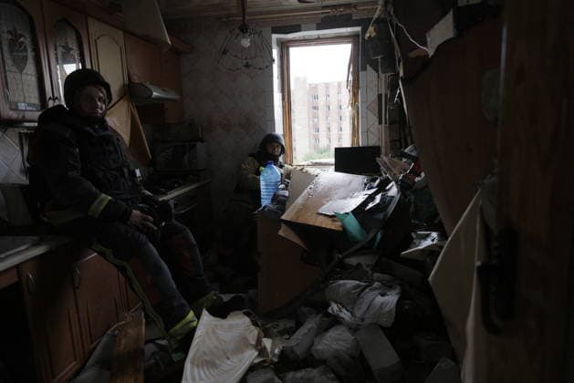 Russian Drone Strike On Residential Building - Kharkiv Two residents take shelter in a heavily damaged apartment in Kharkiv, Ukraine, on August 9, 2026. A drone strike hit a multi-story residential building in the Saltivka district, destroying multiple floors and killing two people, with dozens more wounded. The interior shows extensive damage, scattered debris, and belongings strewn across the floor; a view through the open doorway reveals the damaged facade of a neighboring high-rise building. Photo by Yevhen Titov ABACAPRESS.COM Kharkiv Kharkiv Oblast Ukraine  Copyright: xTitovxYevhen ABACAx