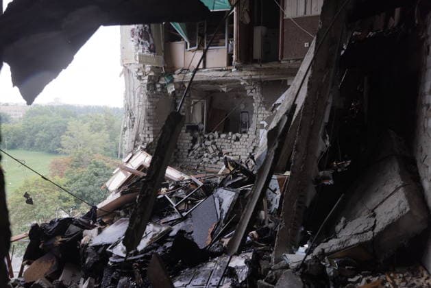 Russian Drone Strike On Residential Building - Kharkiv The interior of a multi-story residential building in Kharkiv s Saltivka district lies destroyed after a drone strike, with charred wooden beams, rubble, and debris scattered across the floor and exposing multiple levels of the structure; a tree-covered landscape is visible through a large opening in the facade on August 9, 2026. The strike destroyed several upper floors of the building, killing two residents and wounding at least 27 others, with rescue efforts ongoing to locate people trapped under the rubble. Photo by Yevhen Titov ABACAPRESS.COM Kharkiv Kharkiv Oblast Ukraine  Copyright: xTitovxYevhen ABACAx