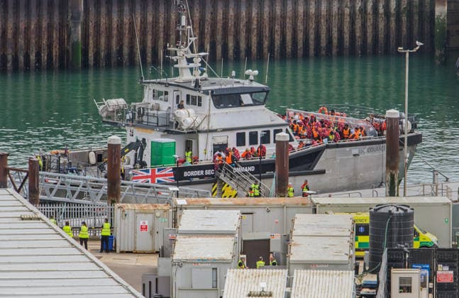 Rescued migrants escorted by BSC Courageous in UK DOVER, UNITED KINGDOM - AUGUST 9: Border Security Command vessel Courageous escort migrants into Dover Docks, Kent, United Kingdom on August 9, 2026. The migrants were rescued in the middle of the channel trying to reach the UK. Stuart Brock Anadolu Dover United Kingdom. Editorial use only. Please get in touch for any other usage.  Copyright: x2026xAnadoluxStuartxBrockx