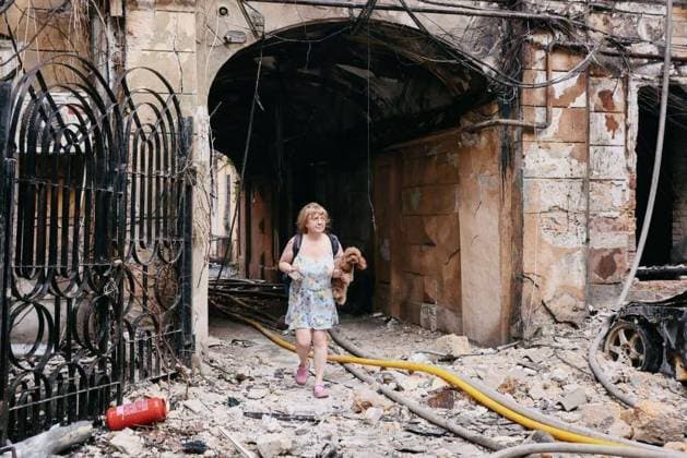 Twelve people injured in Russian combined attack on Odesa region, Ukraine ODESA, UKRAINE - AUGUST 09: (----EDITORIAL USE ONLY - MANDATORY CREDIT - ODESA REGIONAL MILITARY ADMINISTRATION HANDOUT - NO MARKETING NO ADVERTISING CAMPAIGNS - DISTRIBUTED AS A SERVICE TO CLIENTS----) A woman carrying her dog walks through the debris of a damaged residential building following a large-scale combined Russian missile and drone attack on Odesa, Ukraine, on August 9, 2026. Twelve residents sustained moderate injuries in the attack, which damaged and partially destroyed apartment buildings in the city s historic center and caused fires. Odesa Regional Military Administration Handout Anadolu Odessa Ukraine. Editorial use only. Please get in touch  Copyright: x2026xAnadoluxOdesaxRegionalxMilitaryxAdministrationx xHandoutx