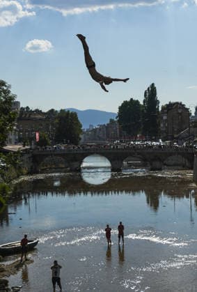 Bentbasa Cliff Diving 2026 in Sarajevo SARAJEVO, BOSNIA AND HERZEGOVINA - AUGUST 9: People jump during the 12th edition of the international Bentbasa Cliff Diving 2026 competition, which is held at Bentbasa, one of the most recognizable locations in Sarajevo, Bosnia and Herzegovina on August 9, 2026. Samir Jordamovic Anadolu Sarajevo Bosnia and Herzegovina. Editorial use only. Please get in touch for any other usage.  Copyright: x2026xAnadoluxSamirxJordamovicx