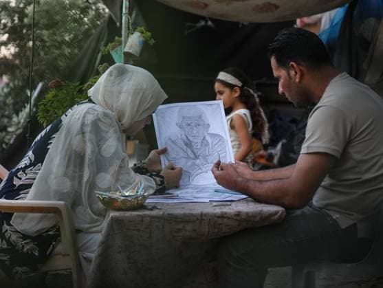 August 10, 2026, Gaza City, Palestine, State of: GAZA Gaza City, GAZA STRIP Ã¢â‚¬ AUGUST 9, 2026: Palestinian artist Nadia Abu Issa creates charcoal drawings depicting the hardships experienced by civilians during the war in Gaza, including shortages of food and water and life under continued displacement and insecurity. Living near an area affected by ongoing military activity, Abu Issa says her artwork aims to document the daily realities faced by Palestinians and preserve their experiences through art. Among her recent works is a portrait of Turkish President Recep Tayyip ErdoÄÅ¸an, which she says she created as a gesture of appreciation for TurkeyÃ¢â‚¬â ¢s support for Palestinians. Gaza City Palestine, State of  - ZUMAq101 20260810_zna_q101_003 Copyright: xRamzixAbuxAmerx