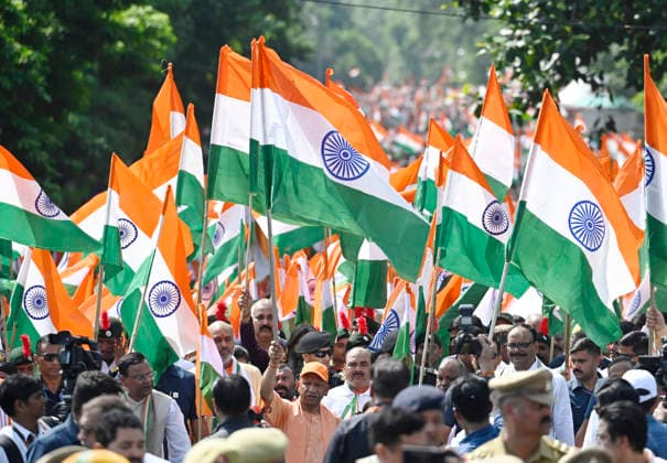 LUCKNOW, INDIA - AUGUST 9: Uttar Pradesh Chief Minister Yogi Adityanath along with deputy CM Keshav Prasad Maurya and deputy CM Brajesh Pathak and BJP state President Pankaj Chaudhary waves national flag during Tiranga Yatra under the Har Ghar Tiranga campaign ahead of the 80th Independence Day on August 9, 2026 in Lucknow, India. (Photo by Deepak Gupta Hindustan Times) UP CM Yogi Adityanath Leads Tiranga Yatra Under Har Ghar Tiranga Campaign Ahead Independence Day