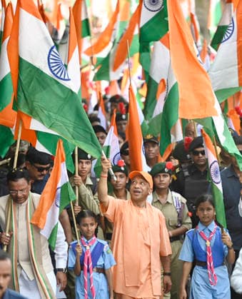 LUCKNOW, INDIA - AUGUST 9: Uttar Pradesh Chief Minister Yogi Adityanath and BJP state President Pankaj Chaudhary wave national flag during Tiranga Yatra under the Har Ghar Tiranga campaign ahead of the 80th Independence Day on August 9, 2026 in Lucknow, India. (Photo by Deepak Gupta Hindustan Times) UP CM Yogi Adityanath Leads Tiranga Yatra Under Har Ghar Tiranga Campaign Ahead Independence Day