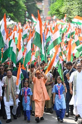 LUCKNOW, INDIA - AUGUST 9: Uttar Pradesh Chief Minister Yogi Adityanath along with deputy CM Keshav Prasad Maurya and deputy CM Brajesh Pathak and BJP state President Pankaj Chaudhary waves national flag during Tiranga Yatra under the Har Ghar Tiranga campaign ahead of the 80th Independence Day on August 9, 2026 in Lucknow, India. (Photo by Deepak Gupta Hindustan Times) UP CM Yogi Adityanath Leads Tiranga Yatra Under Har Ghar Tiranga Campaign Ahead Independence Day