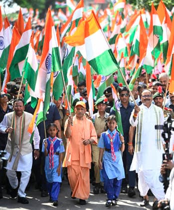 LUCKNOW, INDIA - AUGUST 9: Uttar Pradesh Chief Minister Yogi Adityanath along with deputy CM Keshav Prasad Maurya and deputy CM Brajesh Pathak and BJP state President Pankaj Chaudhary waves national flag during Tiranga Yatra under the Har Ghar Tiranga campaign ahead of the 80th Independence Day on August 9, 2026 in Lucknow, India. (Photo by Deepak Gupta Hindustan Times) UP CM Yogi Adityanath Leads Tiranga Yatra Under Har Ghar Tiranga Campaign Ahead Independence Day