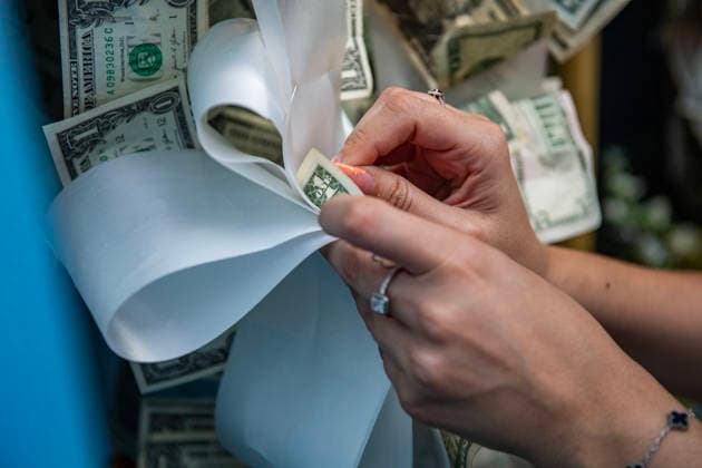 August 9, 2026, Boston, Massachusetts, USA: People pin money to the image of the saint is returned to its home during the Feast of the Madonna Della Cava in the North End of Boston, Massachusetts on August 9, 2026. Boston USA  - ZUMAp158 20260809_aap_p158_003 Copyright: xJosephxPreziosox