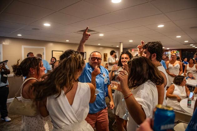 August 9, 2026, Boston, Massachusetts, USA: Patrons dance inside the FishermanÃ¢â‚¬â ¢s club during the Feast of the Madonna Della Cava in the North End of Boston, Massachusetts on August 9, 2026. Boston USA - ZUMAp158 20260809_aap_p158_025 Copyright: xJosephxPreziosox