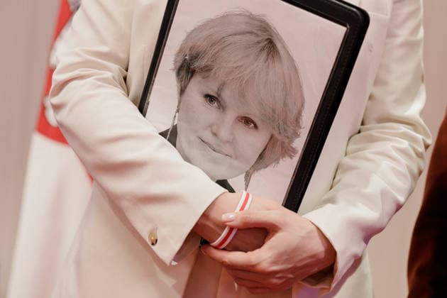 August 9, 2026, Warsaw, Poland: A portrait of TUT.BY CEO Liudmila Chekina is seen on a folder held by Belarusian democratic leader Sviatlana Tsikhanouskaya during the second day of the New Belarus Conference. The second day of the New Belarus Conference brought together representatives of Belarusian democratic forces, activists, former political prisoners, civil society representatives and international partners. The programme focused on discussions about Belarus, support for Belarusians, regional developments and the role of democratic forces in shaping the country™s future. Warsaw Poland - ZUMAs197 20260809_aaa_s197_042 Copyright: xVolhaxShukailax