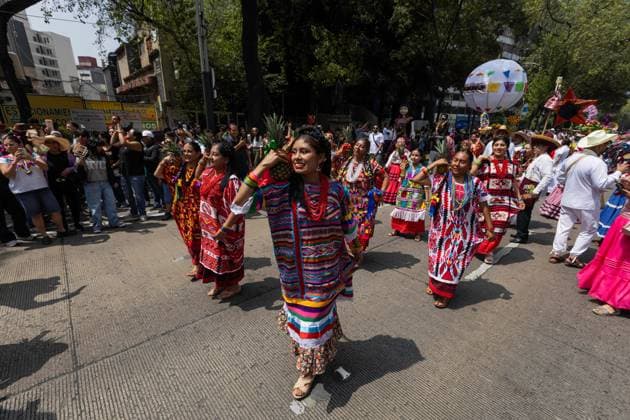 August 9, 2026, Mexico City, Mexico: MEXICO Mexico City, MEXICO Ã¢â‚¬ AUGUST 9, 2026: Participants wearing traditional clothing dance and march during the 17th Mega Calenda cultural parade from the Angel of Independence to the Zocalo in Mexico City, August 9, 2026. Organized by the Mexico City government, the event commemorates the International Day of the World s Indigenous Peoples and is part of the 12th Festival of Indigenous Cultures, Indigenous Peoples, and Native Neighborhoods of Mexico City. Mexico City Mexico  - ZUMAq101 20260809_zna_q101_170 Copyright: xCristianxLeyvax