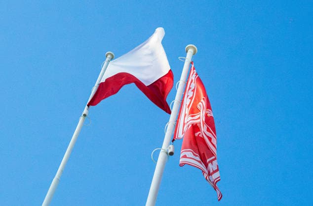 August 9, 2026, Warsaw, Mazovia, Poland: The flag of the Republic of Poland and the Jack of the President of the Republic of Poland are flown during the parade rehearsal. Early in the morning of 9th August, Poland s armed forces, and those of allies stationed in the country, take part in a rehearsal in preparation for a parade on National Armed Forces Day on the 15th August. Soldiers muster as the sun rises over the Vistula River and march past grandstands prepared for dignitaries. The soldiers were followed by mechanised divisions travelling in tanks and a variety of armoured vehicles. Afterwards, Secretary of State in the Ministry of Defence, Pawel Bejda addresses a post-rehearsal press conference, where he is accompanied by the Chief of  - ZUMAs197 20260809_aaa_s197_067 Copyright: xNeilxMiltonx