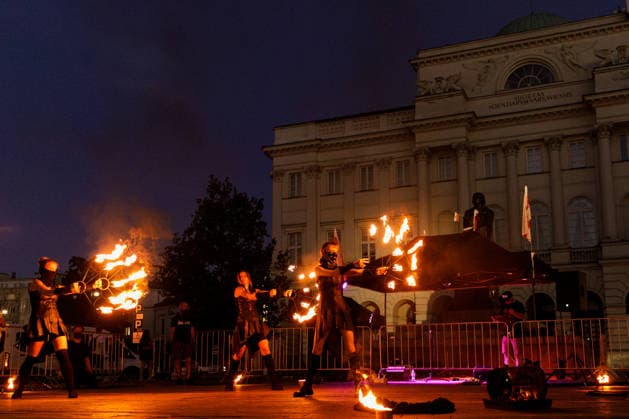 August 9, 2026, Warsaw, Poland: A flare burns near the Nicolaus Copernicus Monument during an evening rally marking the sixth anniversary of the August 2020 presidential election in Belarus. An evening gathering marking the sixth anniversary of the August 2020 presidential election in Belarus was held near the Nicolaus Copernicus Monument in central Warsaw, bringing together leaders of Belarusian democratic forces, public figures and activists, as well as several hundred participants. Warsaw Poland - ZUMAs197 20260809_aaa_s197_105 Copyright: xVolhaxShukailax