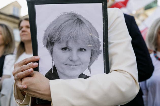 August 9, 2026, Warsaw, Poland: A portrait of TUT.BY CEO Liudmila Chekina is seen on a folder held by Belarusian democratic leader Sviatlana Tsikhanouskaya during an evening rally marking the sixth anniversary of the August 2020 presidential election in Belarus. An evening gathering marking the sixth anniversary of the August 2020 presidential election in Belarus was held near the Nicolaus Copernicus Monument in central Warsaw, bringing together leaders of Belarusian democratic forces, public figures and activists, as well as several hundred participants. Warsaw Poland - ZUMAs197 20260809_aaa_s197_114 Copyright: xVolhaxShukailax