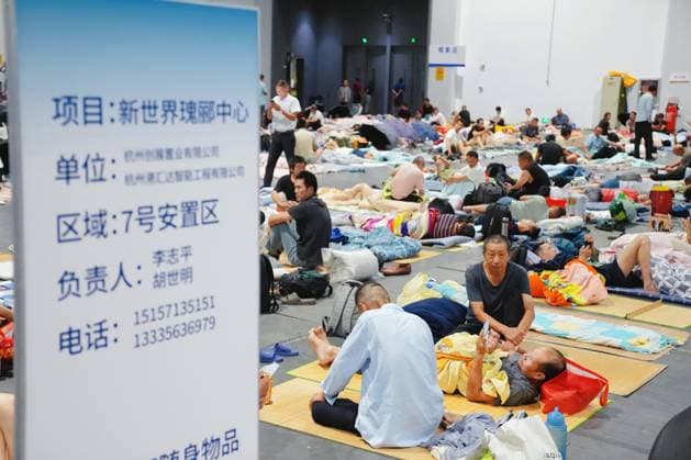HANGZHOU, CHINA - AUGUST 09: A temporary shelter is set up for workers at Qianjiang Century City on August 9, 2026 in Hangzhou, Zhejiang Province of China. Nearly 10,000 workers were safely evacuated from the area as Typhoon Dolphin approaches.  Copyright: xVCGx 111658991041