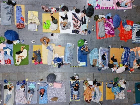HANGZHOU, CHINA - AUGUST 09: A temporary shelter is set up for workers at Qianjiang Century City on August 9, 2026 in Hangzhou, Zhejiang Province of China. Nearly 10,000 workers were safely evacuated from the area as Typhoon Dolphin approaches.  Copyright: xVCGx 111658991037