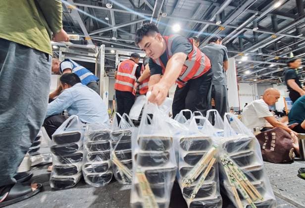 HANGZHOU, CHINA - AUGUST 09: A temporary shelter is set up for workers at Qianjiang Century City on August 9, 2026 in Hangzhou, Zhejiang Province of China. Nearly 10,000 workers were safely evacuated from the area as Typhoon Dolphin approaches.  Copyright: xVCGx 111658991050