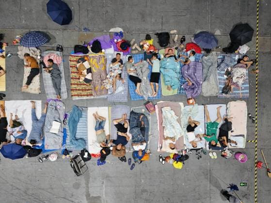 HANGZHOU, CHINA - AUGUST 09: A temporary shelter is set up for workers at Qianjiang Century City on August 9, 2026 in Hangzhou, Zhejiang Province of China. Nearly 10,000 workers were safely evacuated from the area as Typhoon Dolphin approaches.  Copyright: xVCGx 111658990984