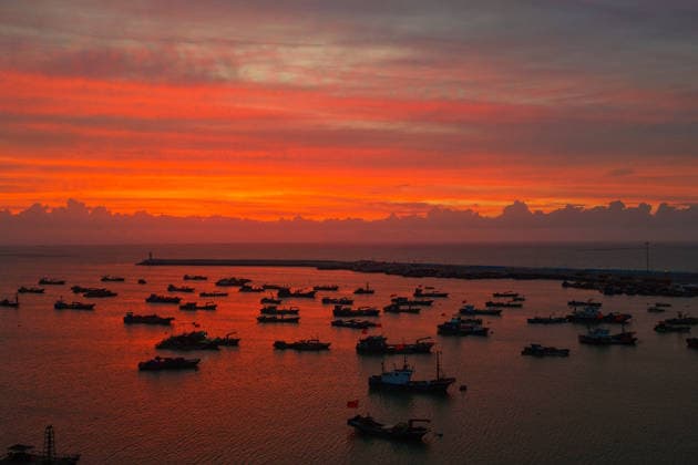 LIANYUNGANG, CHINA - AUGUST 09: Colorful sunset clouds appear over Lian Island as Typhoon Dolphin approaches on August 9, 2026 in Lianyungang, Jiangsu Province of China. The weather phenomenon occurred in the evening as the typhoon affected the coastal area.  Copyright: xVCGx 111659074166