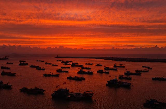 LIANYUNGANG, CHINA - AUGUST 09: Spectacular sunset clouds appear over Liandao Island on August 9, 2026 in Lianyungang, Jiangsu Province of China. The weather phenomenon occurred as Typhoon Dolphin approached the region.  Copyright: xVCGx 111659074169