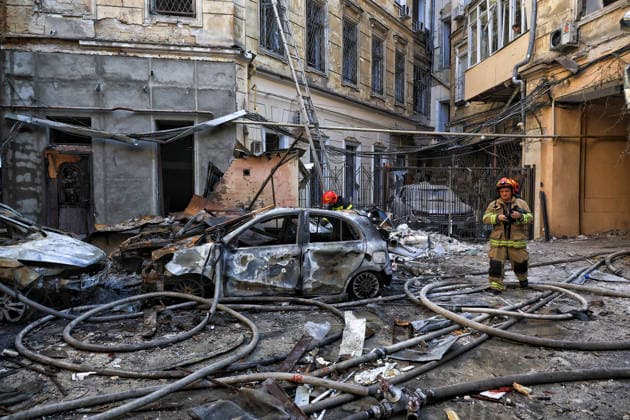 State Emergency Service workers deal with the aftermath of a Russian strike in the courtyard of a multi-storey apartment block, Odesa, Ukraine, August 9, 2026. On Sunday night, August 9, the Russian army carried out a massive combined attack on Odesa, causing significant destruction in two districts of the southern Ukrainian port city. In central Odesa, a Russian missile hit a four-storey residential building, where two floors were completely burnt out. Two private houses and offices were also damaged. At least six civilian cars were destroyed or badly damaged in courtyards by falling debris and direct hits. Damage to energy facilities led to a temporary blackout, with partial power outages in the Peresypskyi (Poskot), Prymorskyi, Khadzhybe  Copyright: xNinaxLiashonokx
