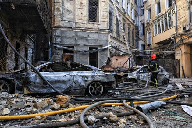 State Emergency Service workers deal with the aftermath of a Russian strike in the courtyard of a multi-storey apartment block, Odesa, Ukraine, August 9, 2026. On Sunday night, August 9, the Russian army carried out a massive combined attack on Odesa, causing significant destruction in two districts of the southern Ukrainian port city. In central Odesa, a Russian missile hit a four-storey residential building, where two floors were completely burnt out. Two private houses and offices were also damaged. At least six civilian cars were destroyed or badly damaged in courtyards by falling debris and direct hits. Damage to energy facilities led to a temporary blackout, with partial power outages in the Peresypskyi (Poskot), Prymorskyi, Khadzhybe  Copyright: xNinaxLiashonokx