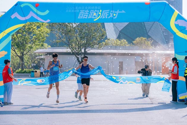 SHENZHEN, CHINA - AUGUST 08: Participants take part in the Run, Teenagers 2026 Longgang District National Fitness Day themed event at Shenzhen Universiade Sports Centre on August 8, 2026 in Longgang District, Shenzhen City, Guangdong Province of China. The event marks the 18th National Fitness Day, featuring a morning run followed by water gun battles and a music party to promote public fitness.  Copyright: xVCGx 111659152158